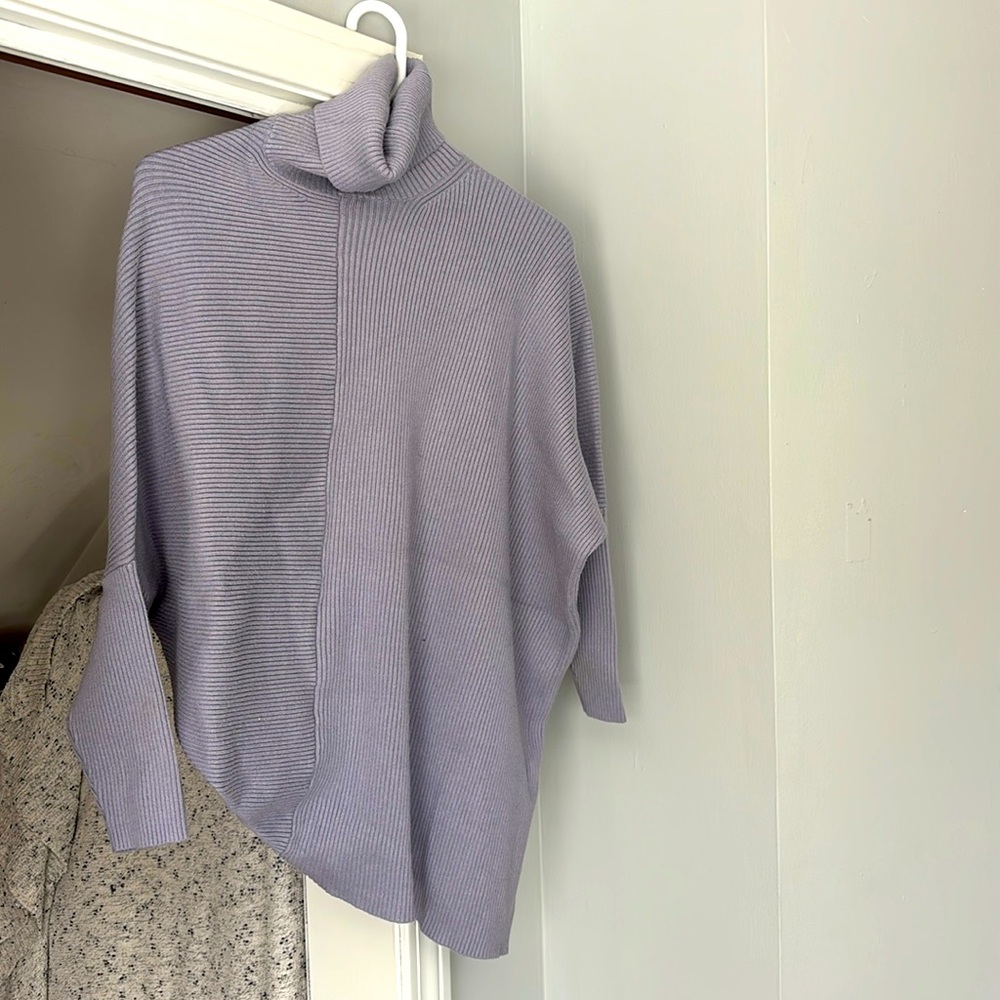 Purple sweater, material is soft and thicker than picture shows very warm